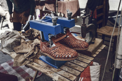 High angle view of old shoes at workshop