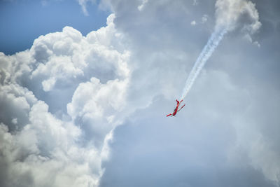 Low angle view of airshow against sky