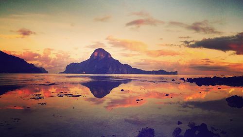 Scenic view of lake against sky during sunset