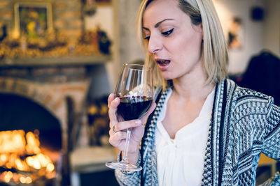 Close-up of woman drinking wine