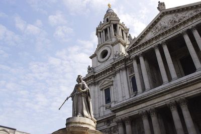 Low angle view of statue against cloudy sky