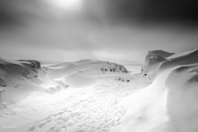 Low angle view of snow capped mountain against sky