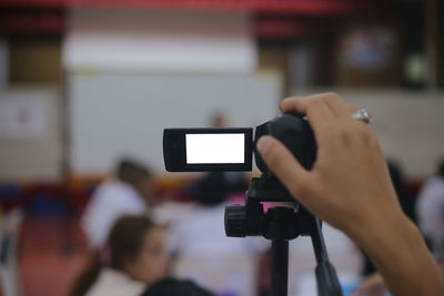 Midsection of man using mobile phone