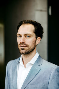 Portrait of businessman standing in office