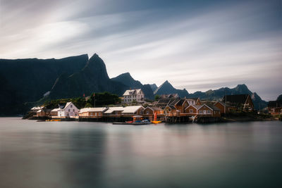 Scenic view of sea and buildings against sky