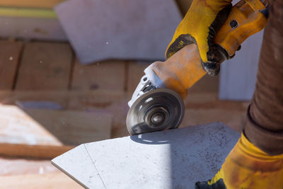 Low section of man working at workshop