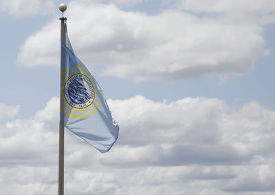 South dakota state flag waving in blue sky