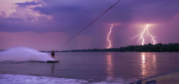 Lightning over sea against sky