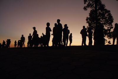 Silhouette of woman at sunset