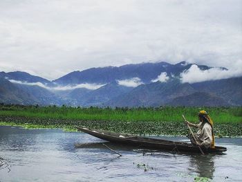 Scenic view of lake against mountain range