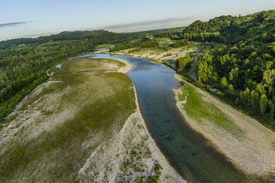 Scenic view of river with trees in background