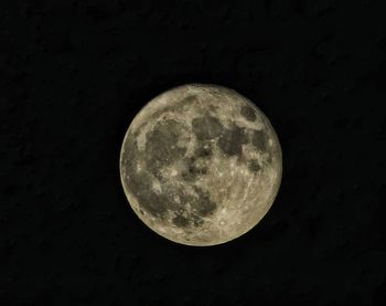 Low angle view of moon against sky at night