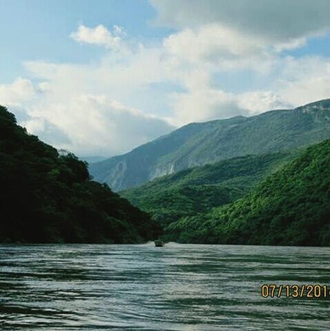 mountain, tranquil scene, water, mountain range, tranquility, scenics, sky, beauty in nature, lake, nature, tree, cloud - sky, idyllic, river, non-urban scene, cloud, waterfront, landscape, day, outdoors