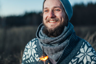 Portrait of smiling young man in winter