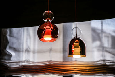 Low angle view of illuminated pendant light