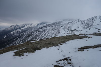 Snow covered mountain against sky