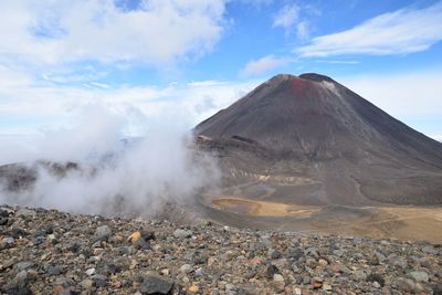 Scenic view of volcanic mountain against sky