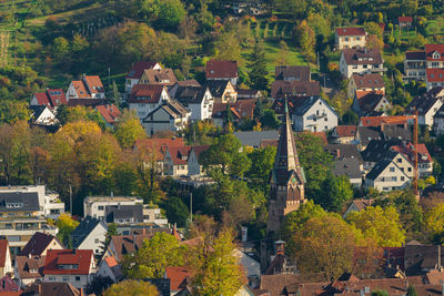 High angle view of houses and trees in town