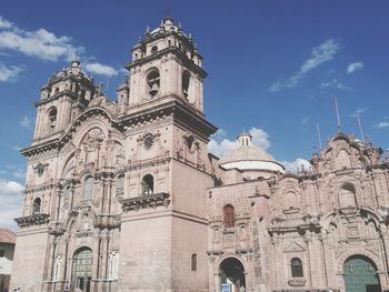 Low angle view of bell tower against sky