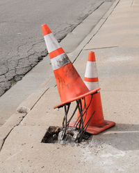 Traffic cones on sidewalk in city