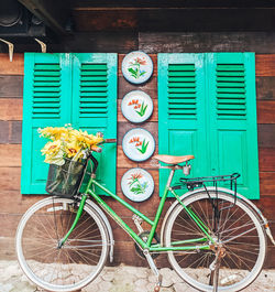 Bicycle parked against wall