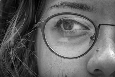 Close-up portrait of woman with eyeglasses