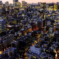 High angle view of illuminated city at dusk