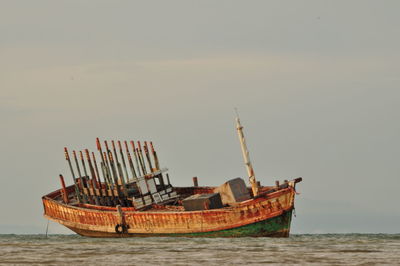 Ship in sea against sky