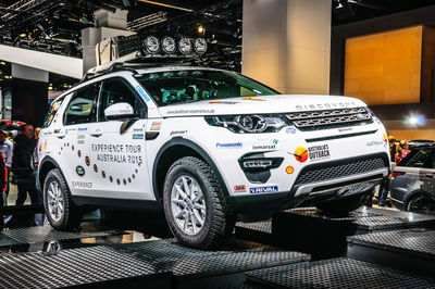 Cars parked on street in city at night
