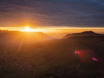 Scenic view of mountains against sky during sunset