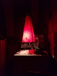 Illuminated red lamp at home