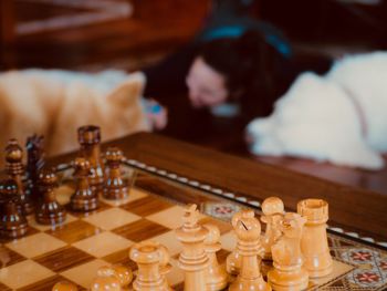 Close-up of chess pieces on table