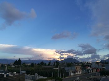 High angle view of town against cloudy sky