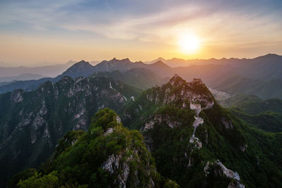 Panoramic view of mountains against sky during sunset