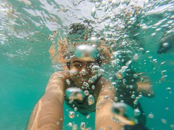 Close-up of man swimming in sea