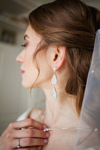 Close-up of young woman looking away