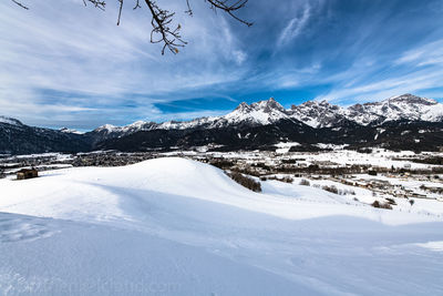 Scenic view of snowcapped mountains against sky