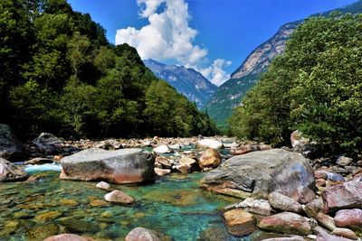 Scenic view of rocks in mountains against sky