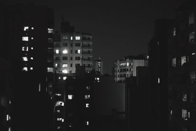 Illuminated buildings in city at night