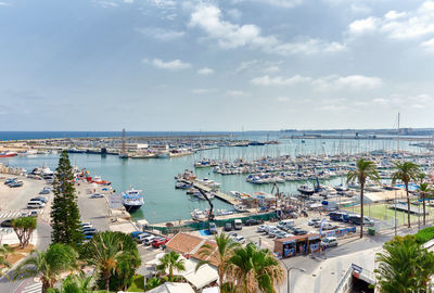 High angle view of harbor by sea against sky