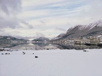 Scenic view of snow covered mountains against sky