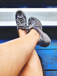 Low section of woman sitting on floor