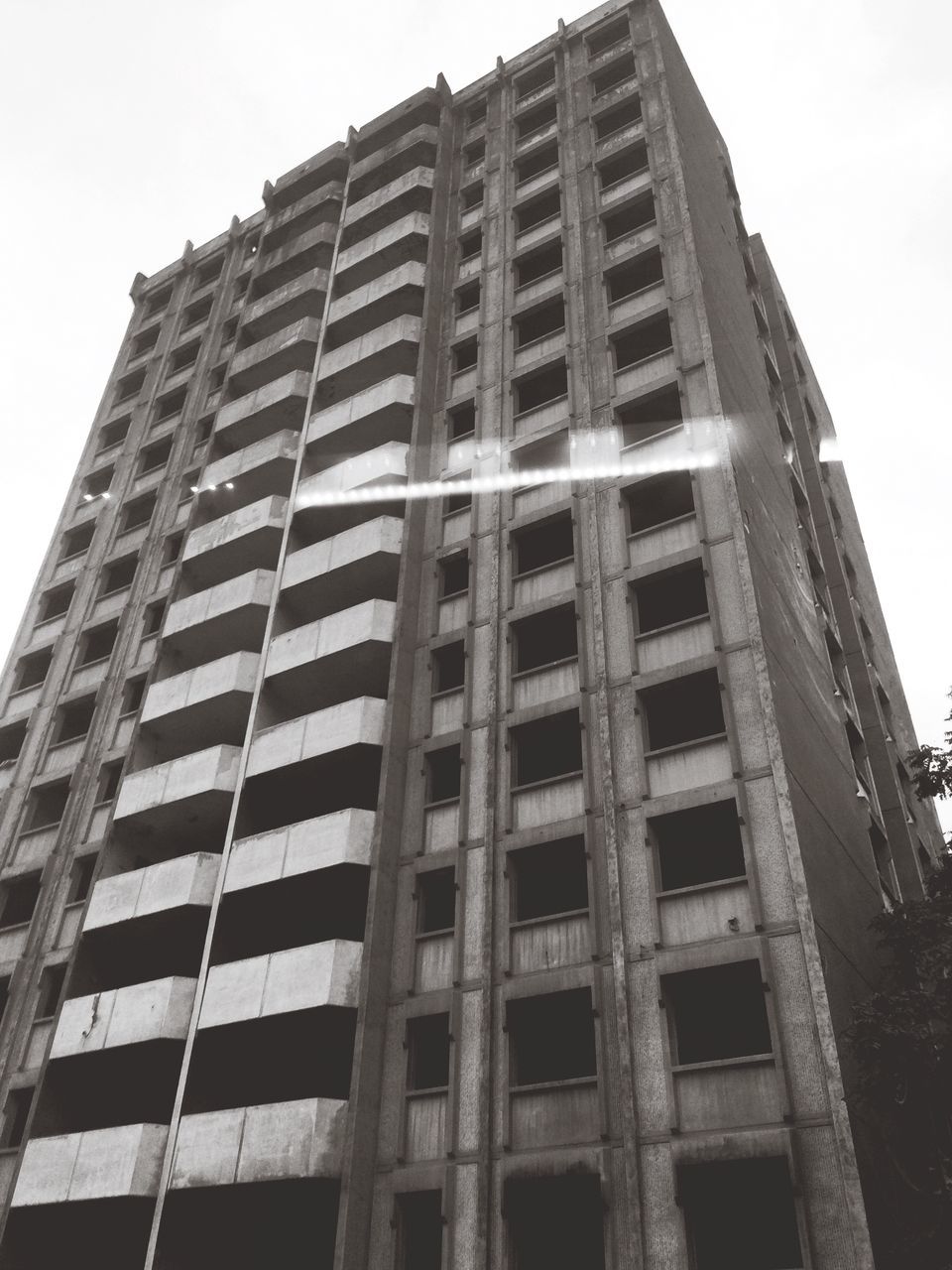 low angle view, building exterior, architecture, built structure, sky, city, tower, skyscraper, outdoors, clear sky, day, no people, repetition, modern