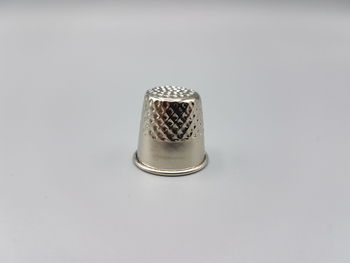 High angle view of drinking glass against white background