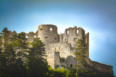 Low angle view of historic building against clear blue sky