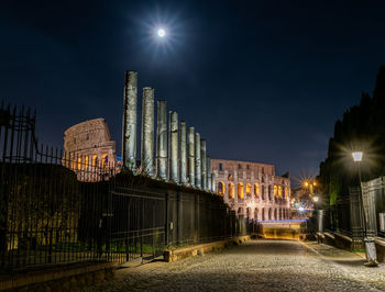 Low angle view of illuminated buildings at night