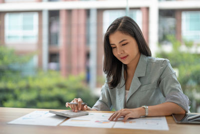 Businesswoman working at table