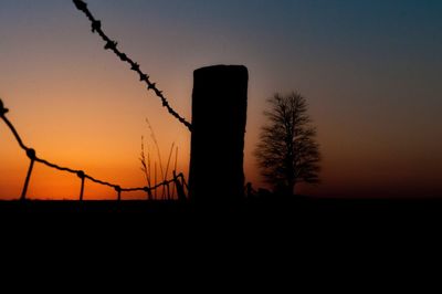 Silhouette tree against sky during sunset