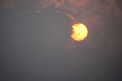 Low angle view of moon against sky at night