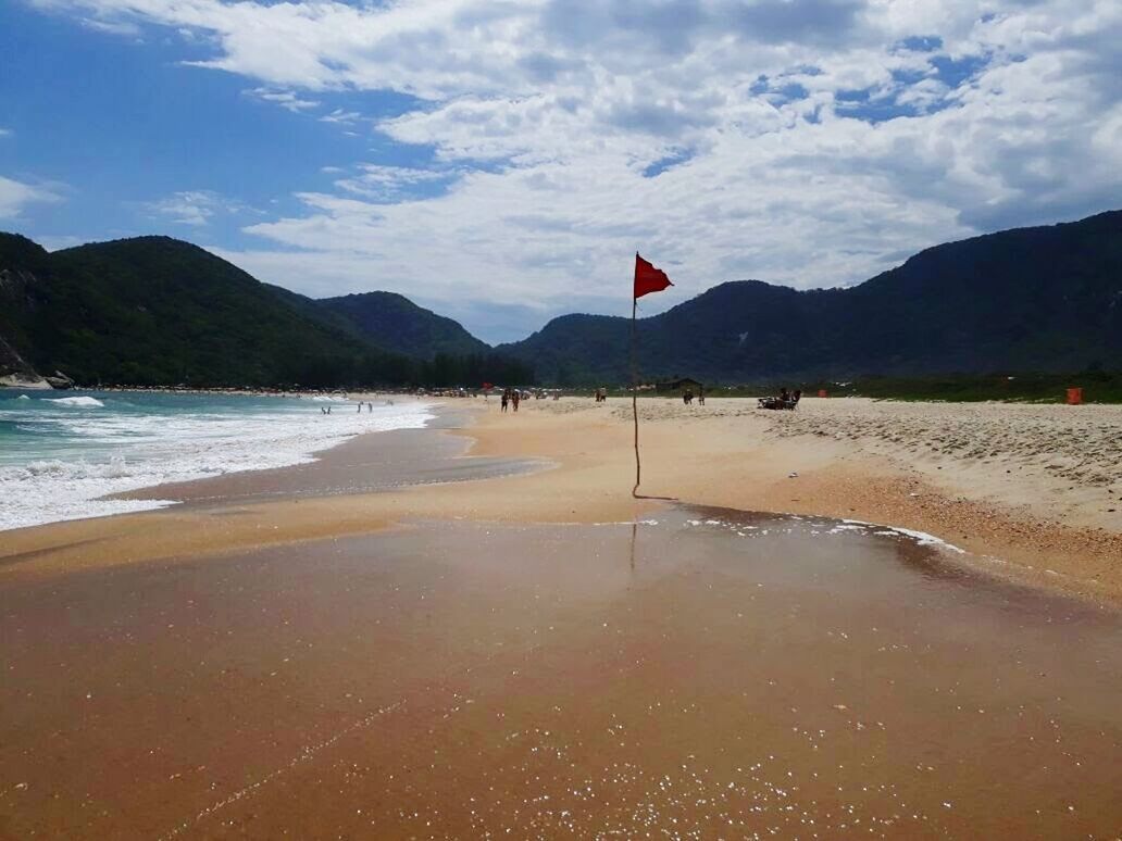 flag, patriotism, mountain, water, sky, nature, beauty in nature, sea, beach, outdoors, scenics, no people, day